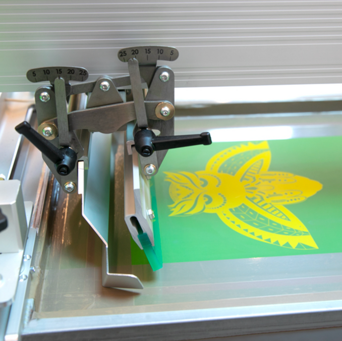 Close up of Screen with Yellow owl being printed on ROQ NEXT P16 XL Automatic Screen Printing Press